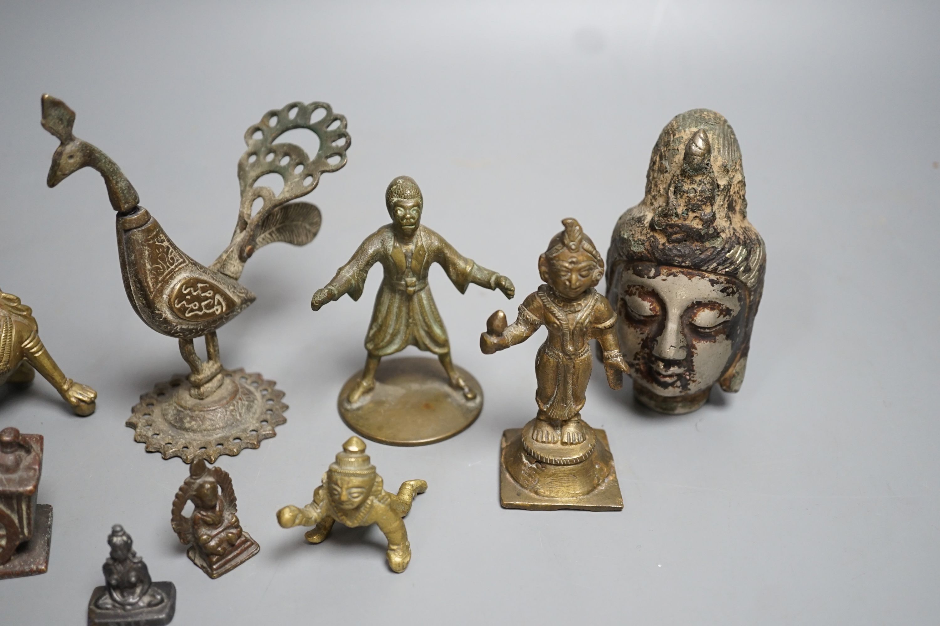 A group of Indian and Himalayan bronze and brass figures, Tallest 12 cm